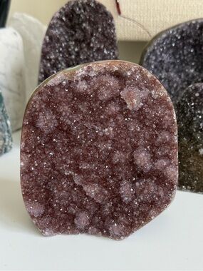 Natural sparkly mauve amethyst cut base specimen